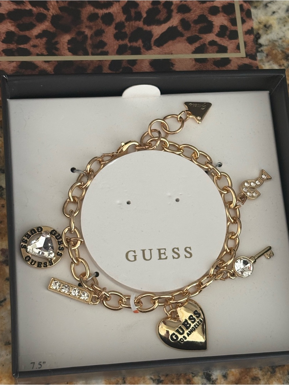 GUESS Gold-Tone Charm Bracelet with Heart, Key & Crystal Charms